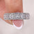 White gold princess cut wedding band with halo setting.