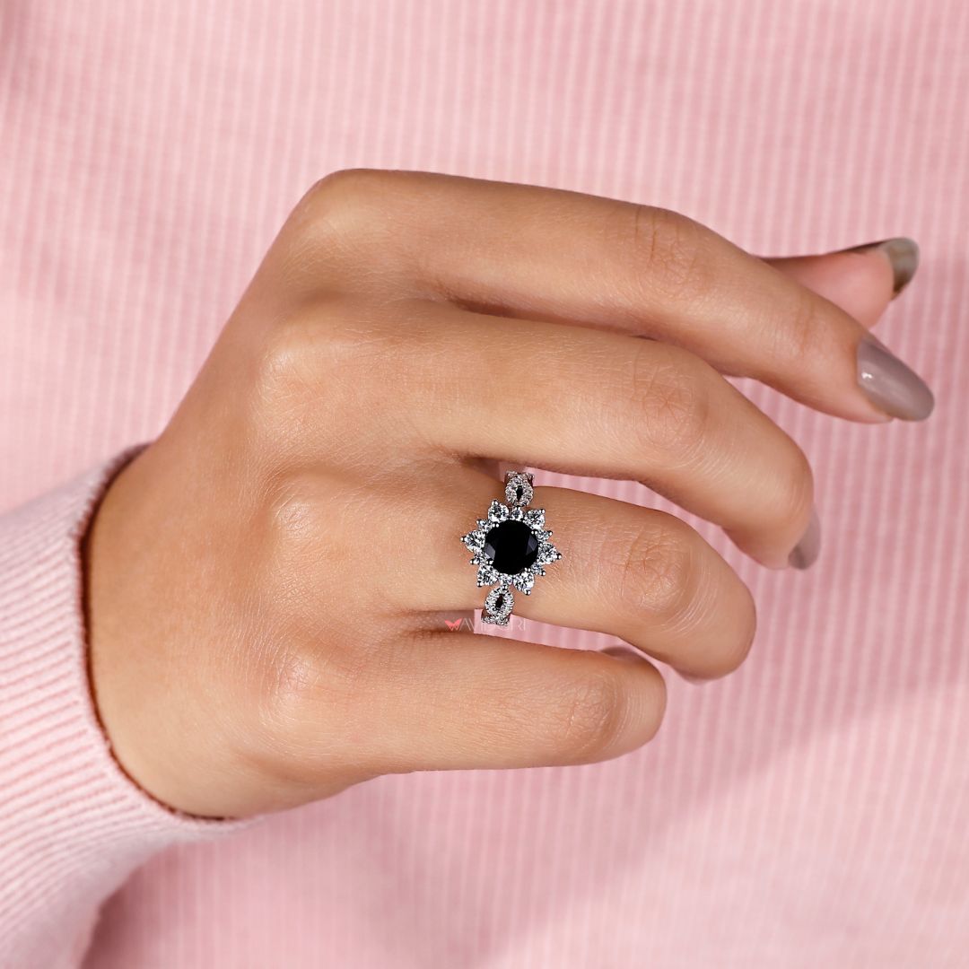 Avideri ring featuring a round cut stone in a unique and elegant design.
