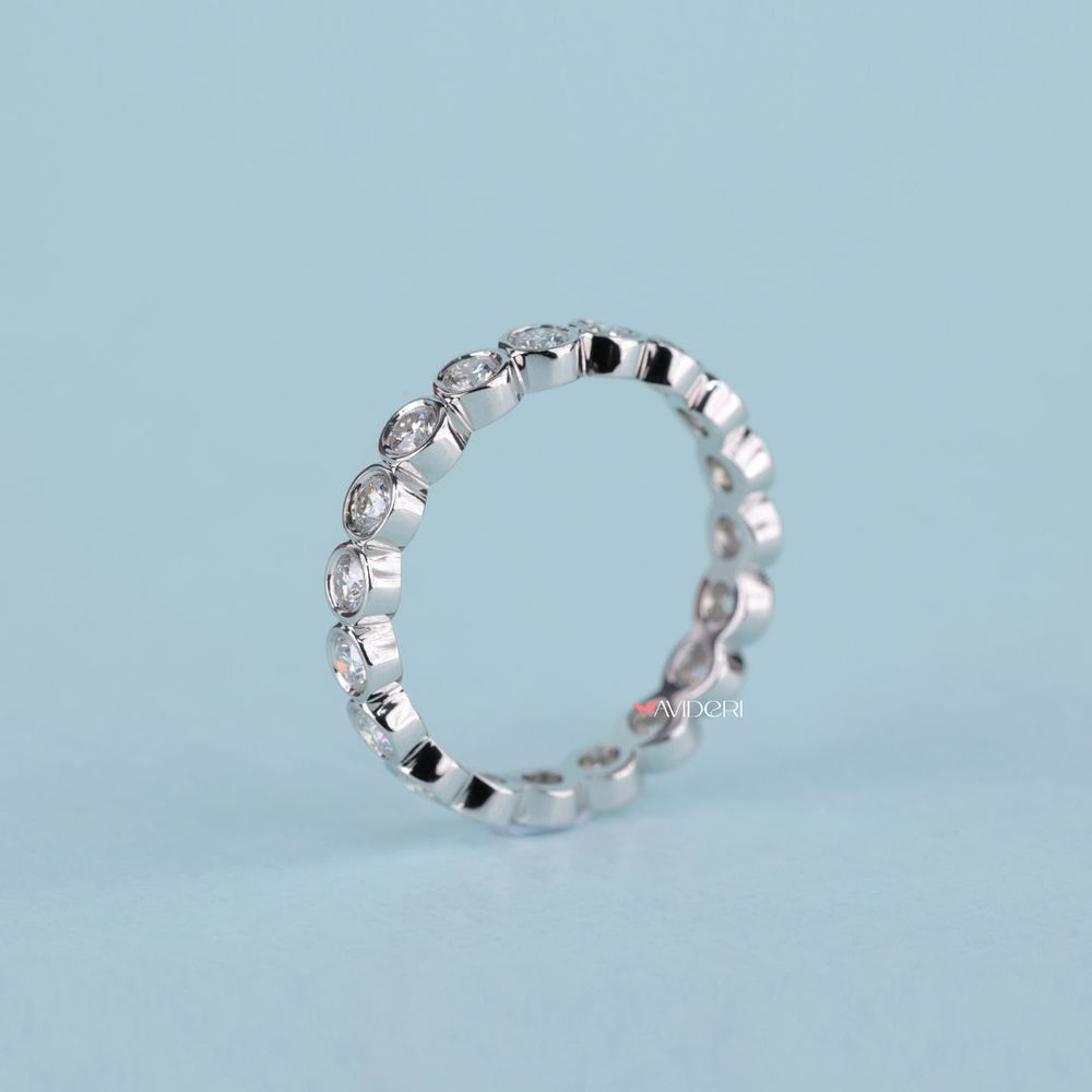 Moissanite wedding band blends bright sparkle with sustainable craftsmanship.
