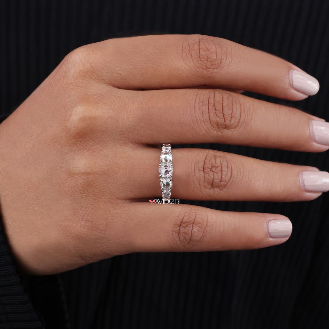 Claw prong setting securely holds each stone while enhancing brilliance.
