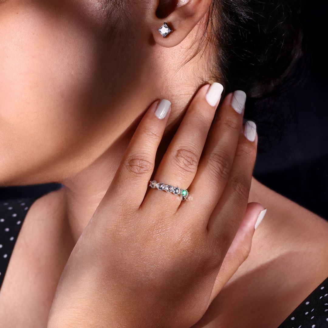 Half eternity wedding band offers comfortable wear with continuous sparkle on one side.
