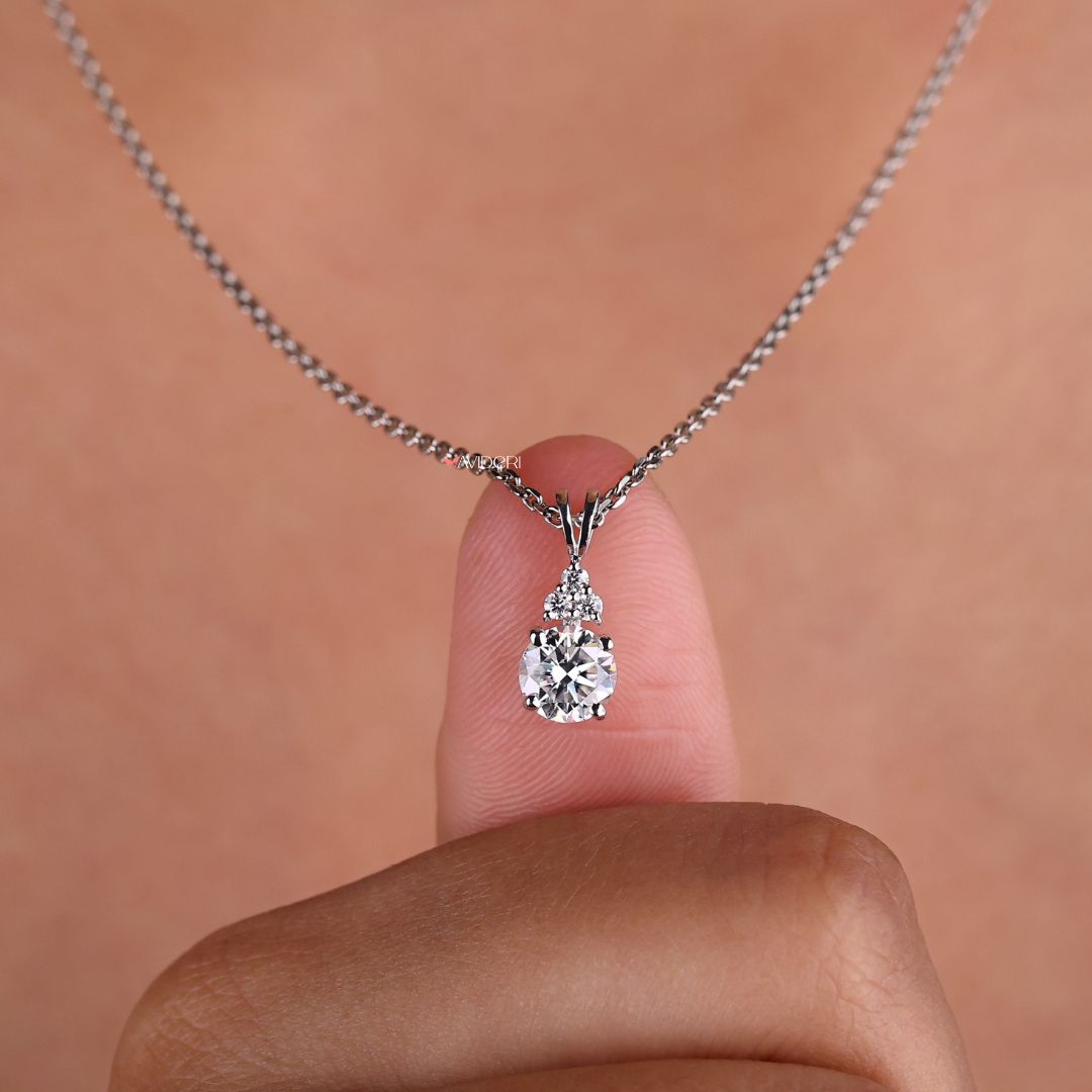 Muse pendant with a round cut moissanite stone for added brilliance.
