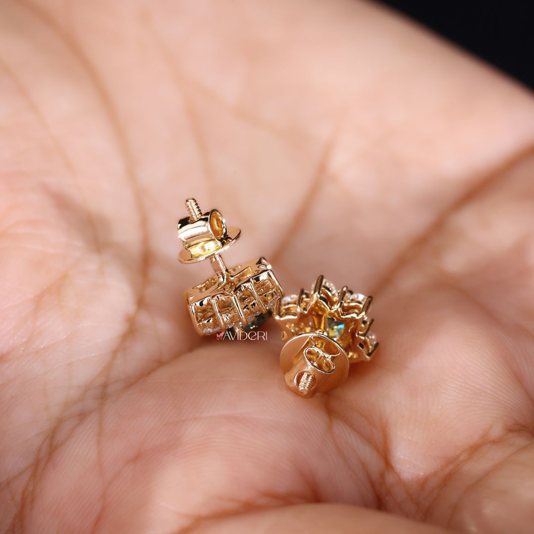 Round cut earrings in a halo cluster design set in yellow gold.