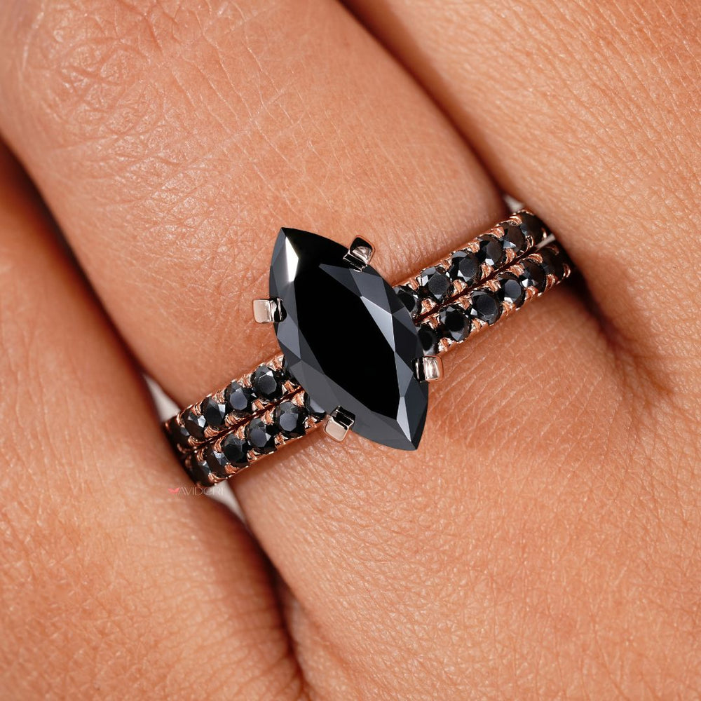 Black moissanite engagement ring with a stunning marquise centerpiece and timeless design.