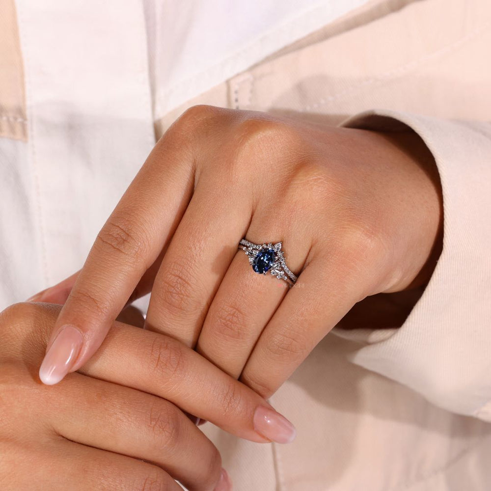 Dark blue moissanite ring featuring a unique snowdrift-inspired design.
