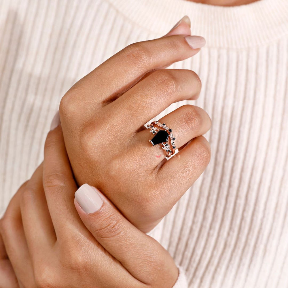 Black moissanite ring paired with an antique filigree engagement ring.