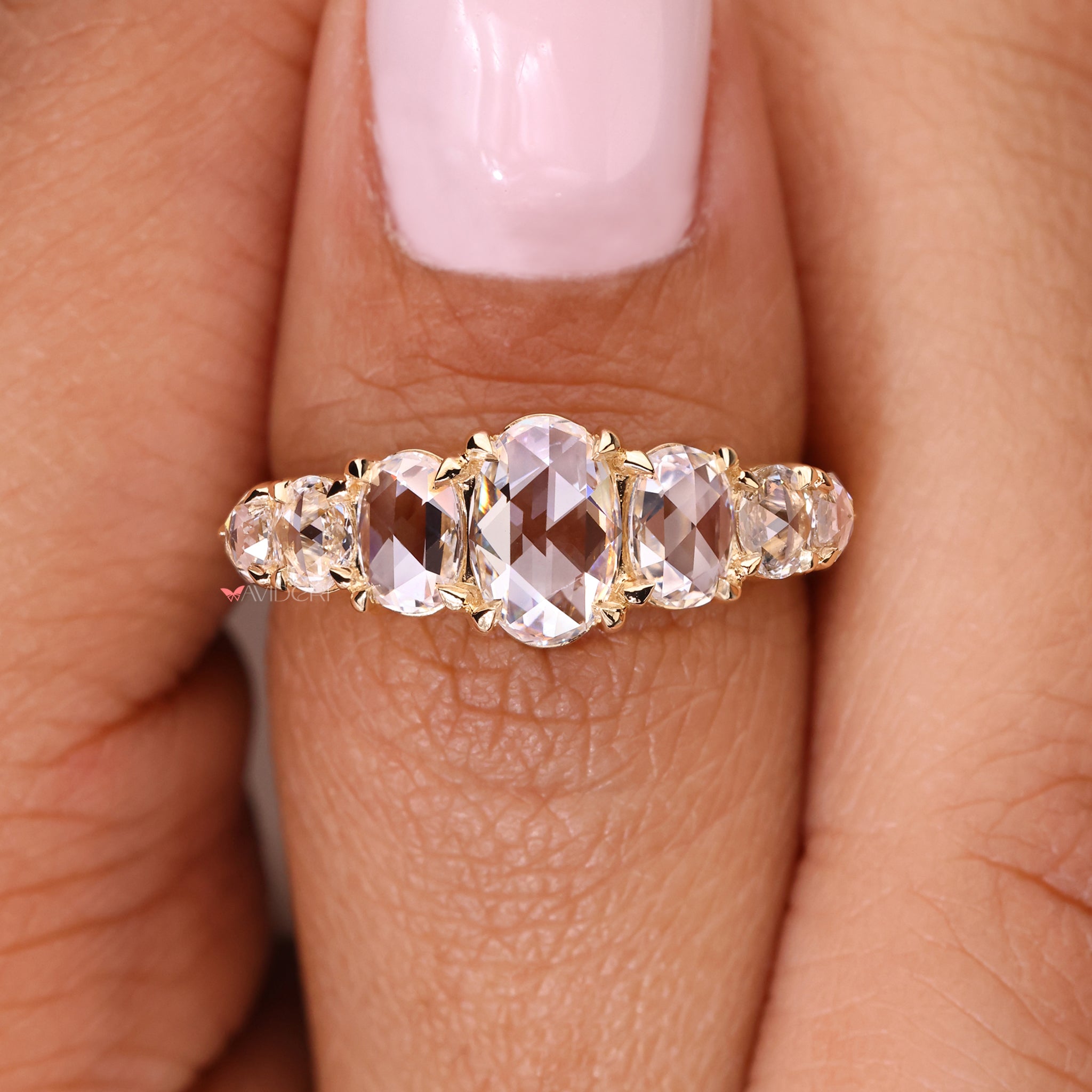 Handmade jewelry with an oval diamond wedding band for timeless beauty.
