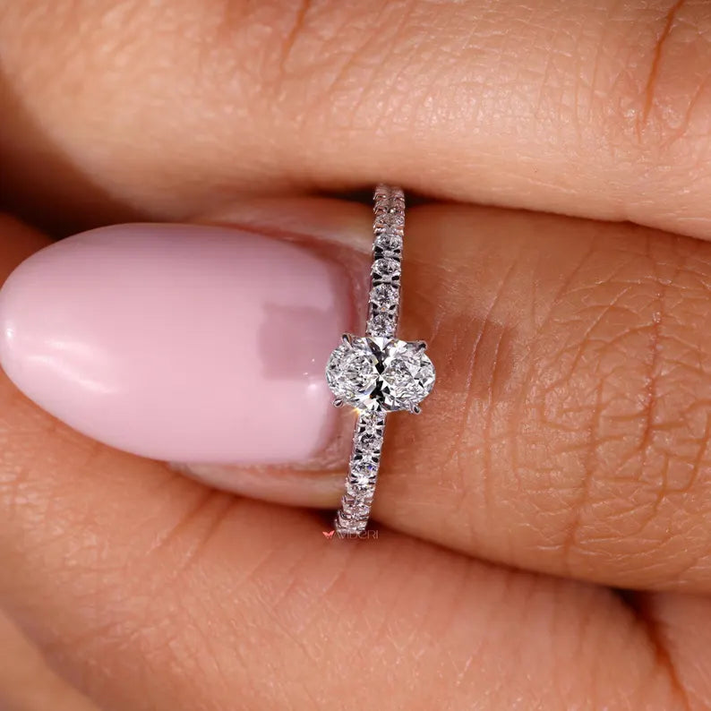 Gold engagement ring with a handmade ring setting.
