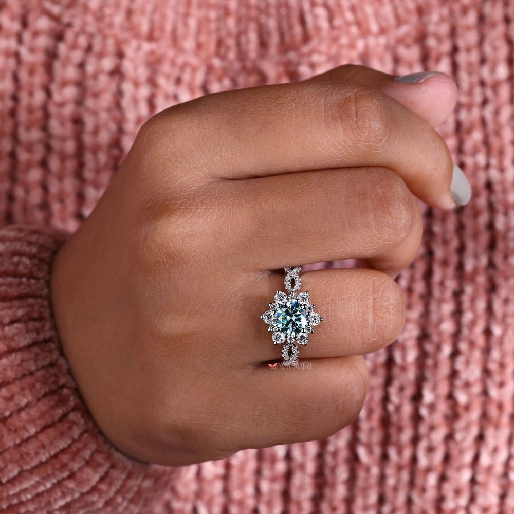 Pave band ring set in white gold with a halo engagement ring and round cut stone.
