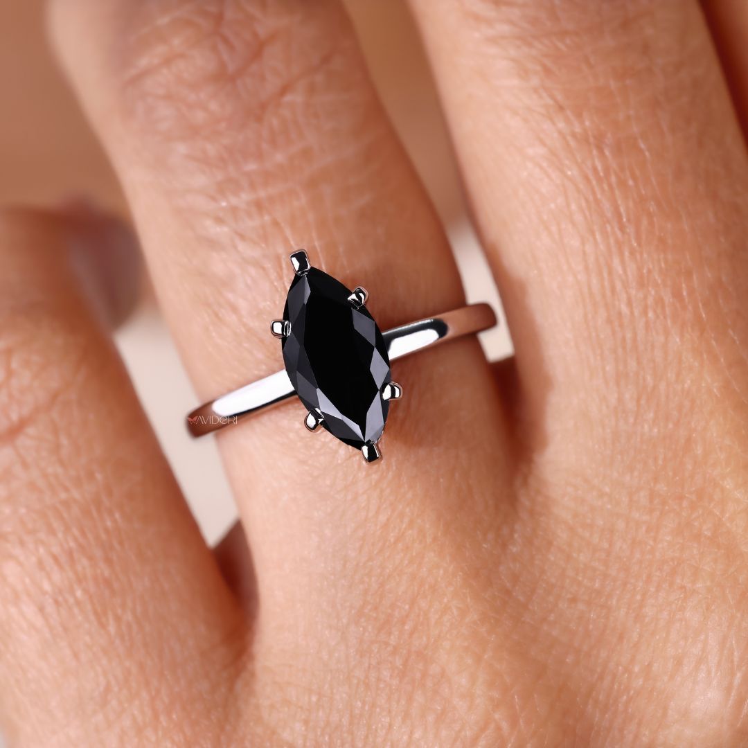 Handmade ring featuring marquise moissanite for a custom, unique style.
