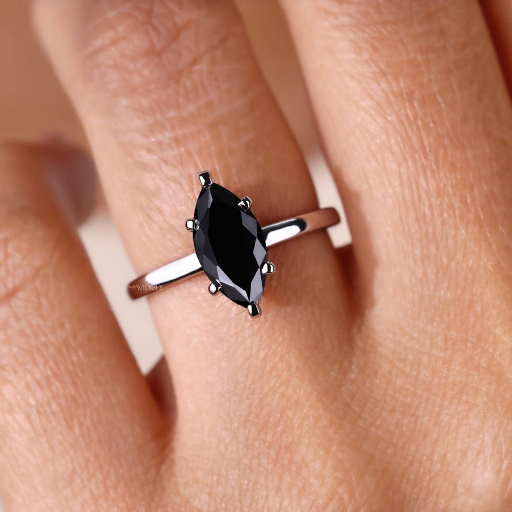 Handmade ring featuring marquise moissanite for a custom, unique style.
