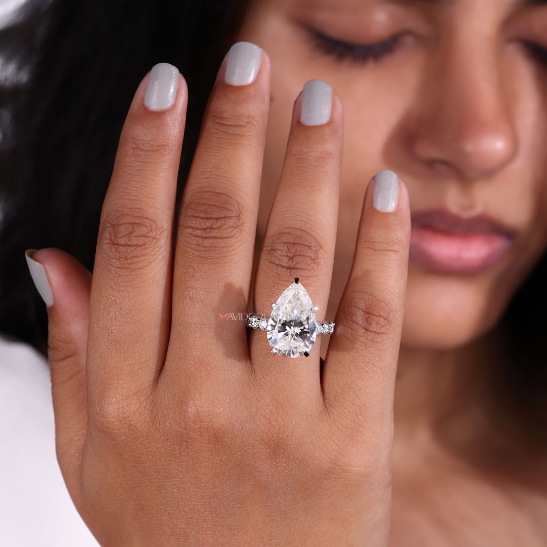Handmade ring with a pear-shaped center stone.
