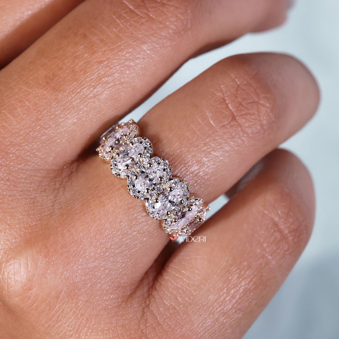 Round halo eternity band in yellow gold.