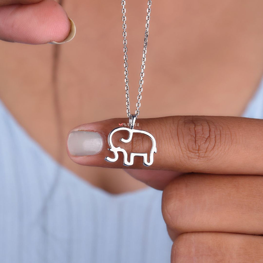 White gold pendant with unique elephant charm.
