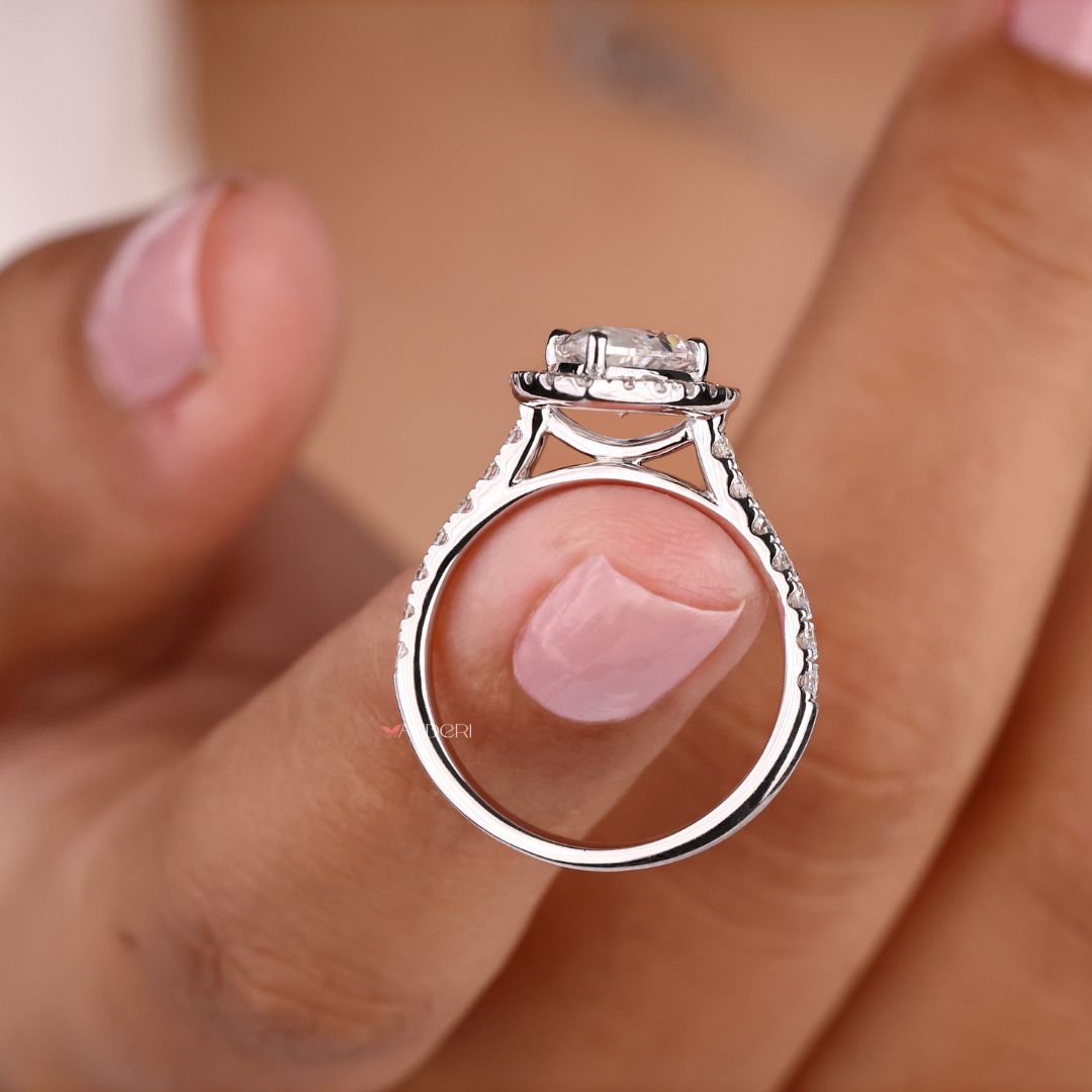 Halo setting ring that surrounds a marquise center
