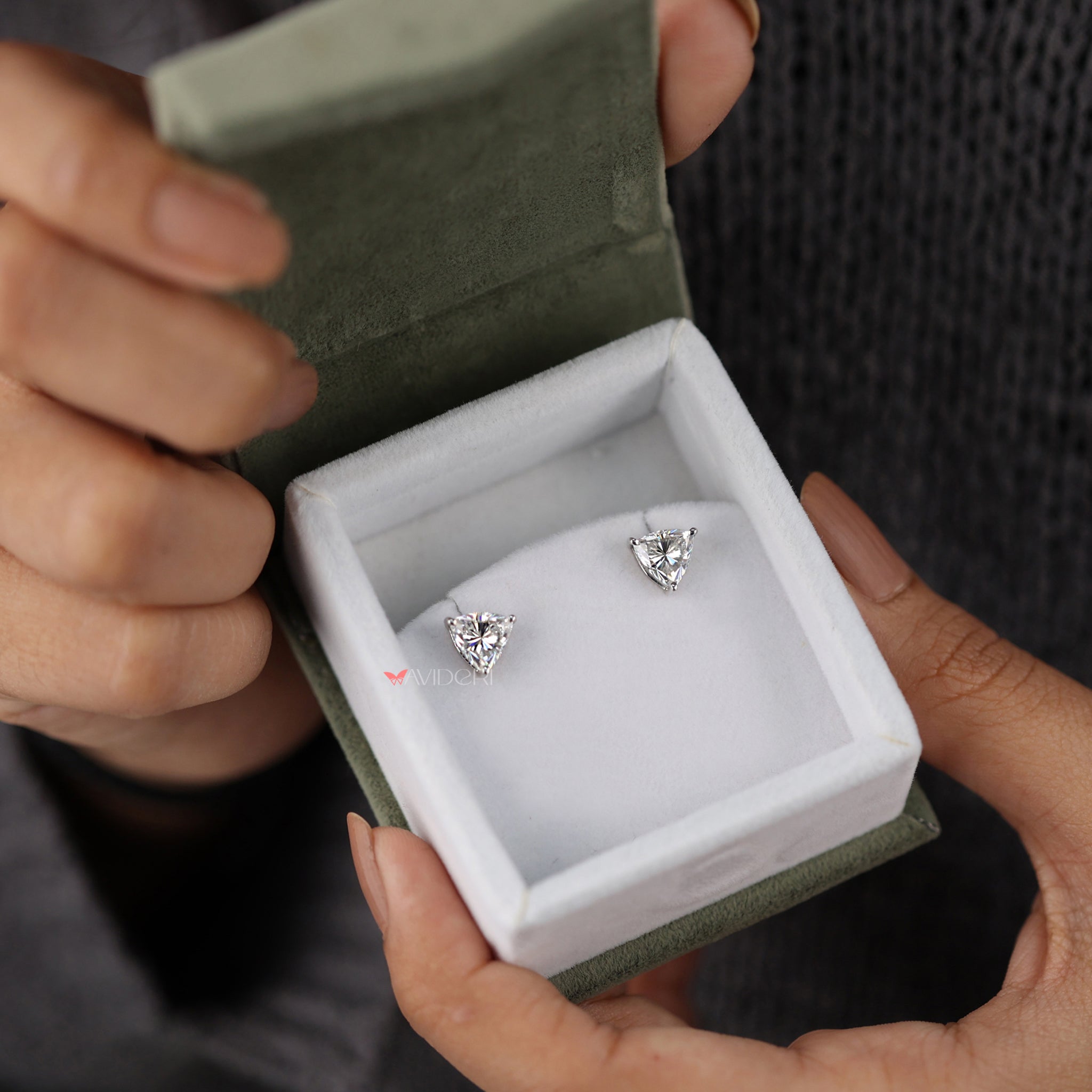 The trillion cut earrings offer a unique and bold design.
