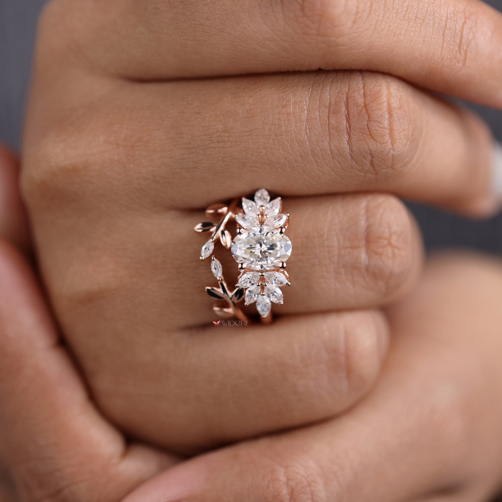 Rose gold bridal sets featuring oval and marquise cut leaf style rings.
