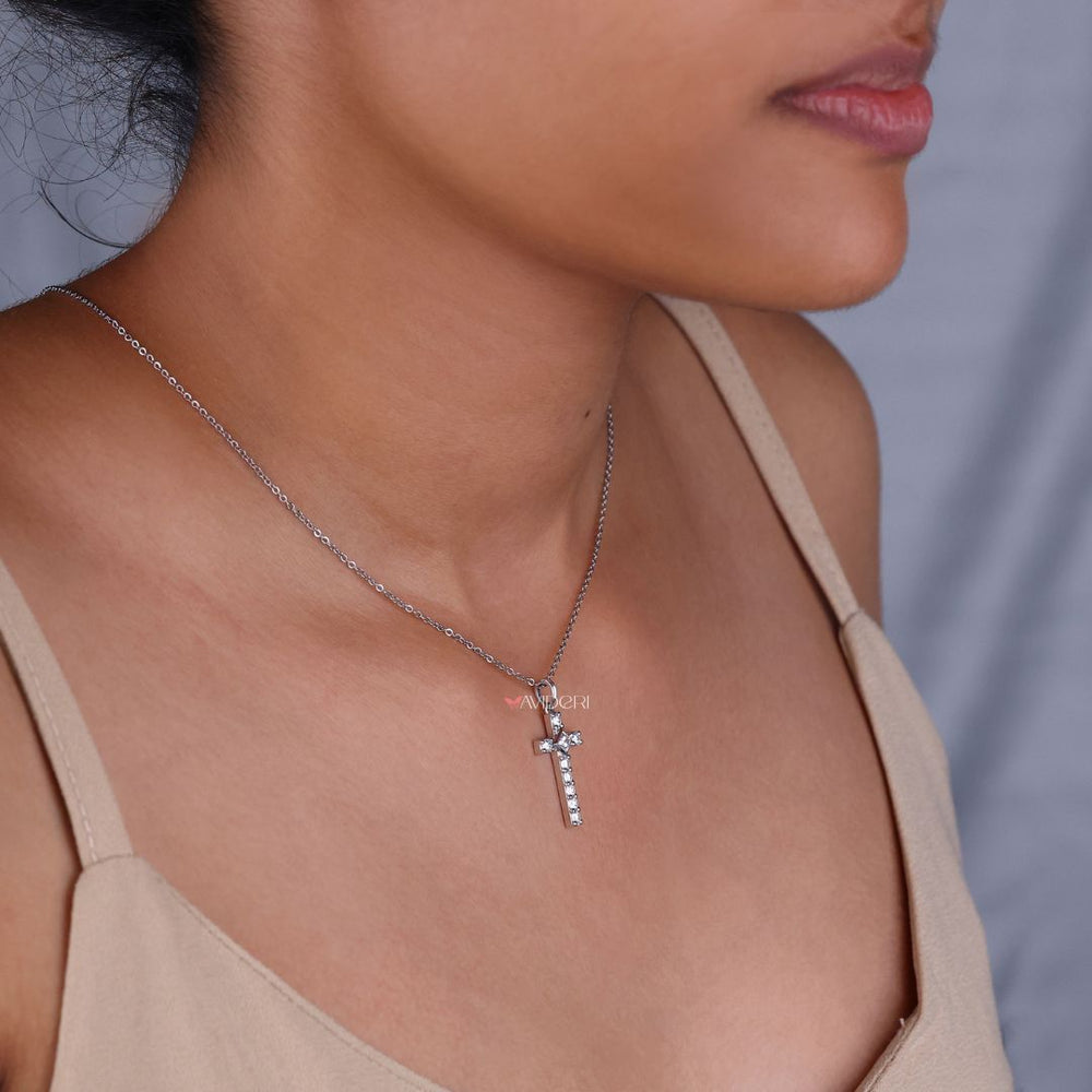 Handmade jewelry showcasing a white gold cross
