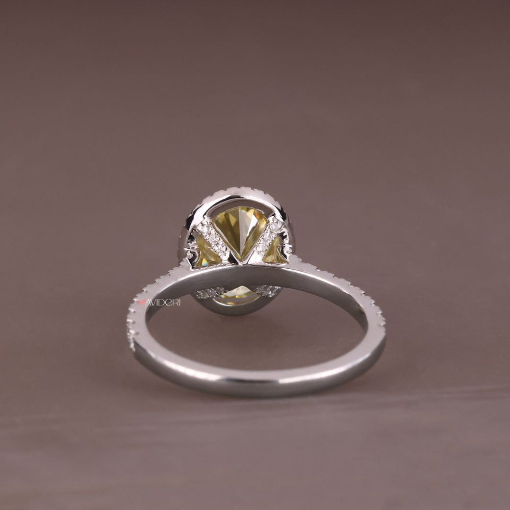 Moissanite halo ring with brilliant, radiant stones surrounding it.
