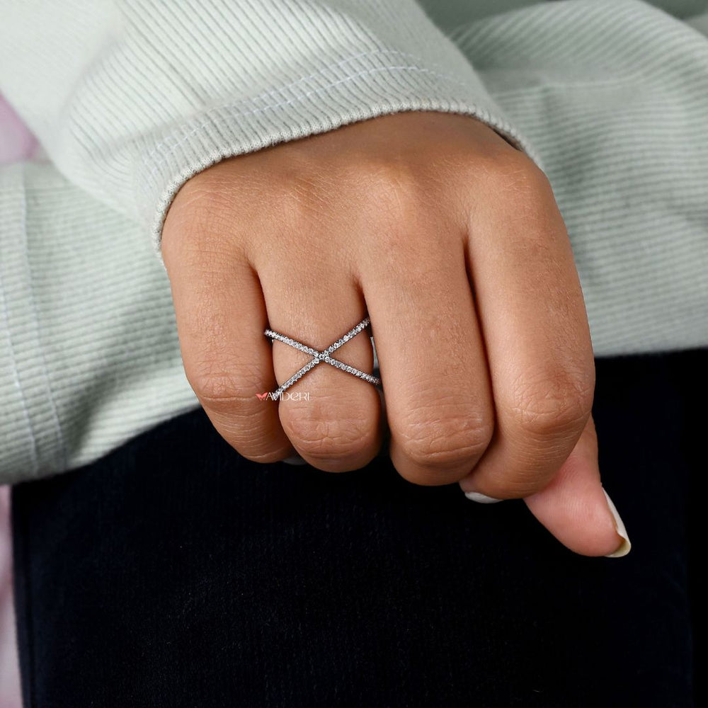 Black band complements moissanite with a dramatic, sophisticated design.

