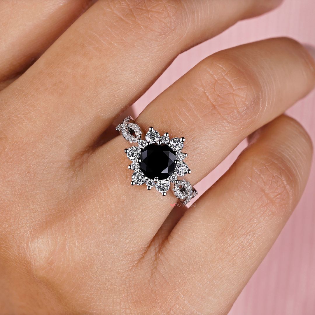 Handmade ring with a round cut center stone, crafted with care.
