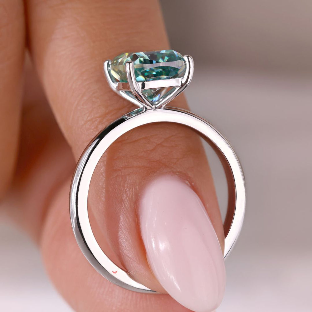 White gold engagement ring featuring a beautiful cushion cut stone.
