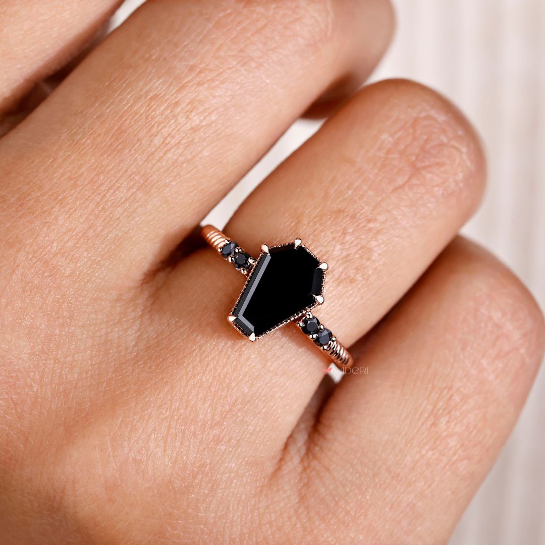 Handmade ring featuring a stunning coffin engagement ring with intricate details.
