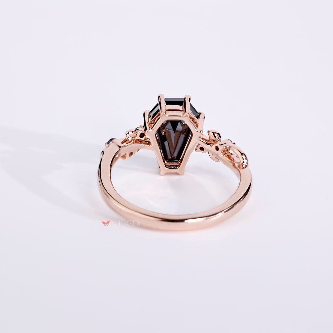 rose gold ring with a coffin setting and sparkling diamond details.
