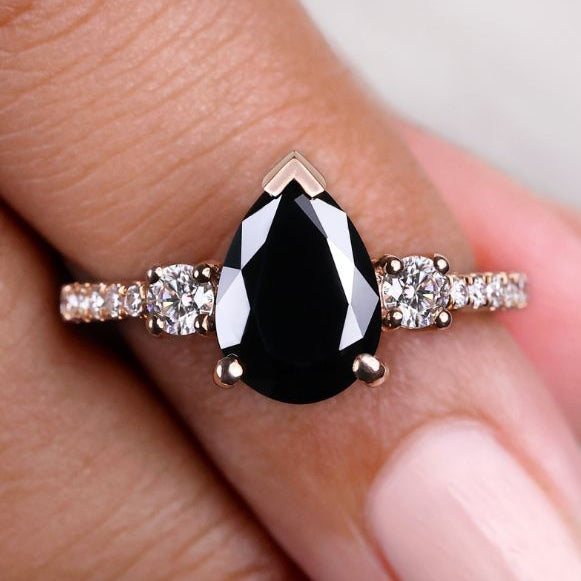 Rose gold pear shaped engagement ring with timeless elegance
