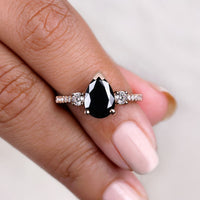 Black Rose Gold Pear Shaped Engagement Ring Three Stone Style