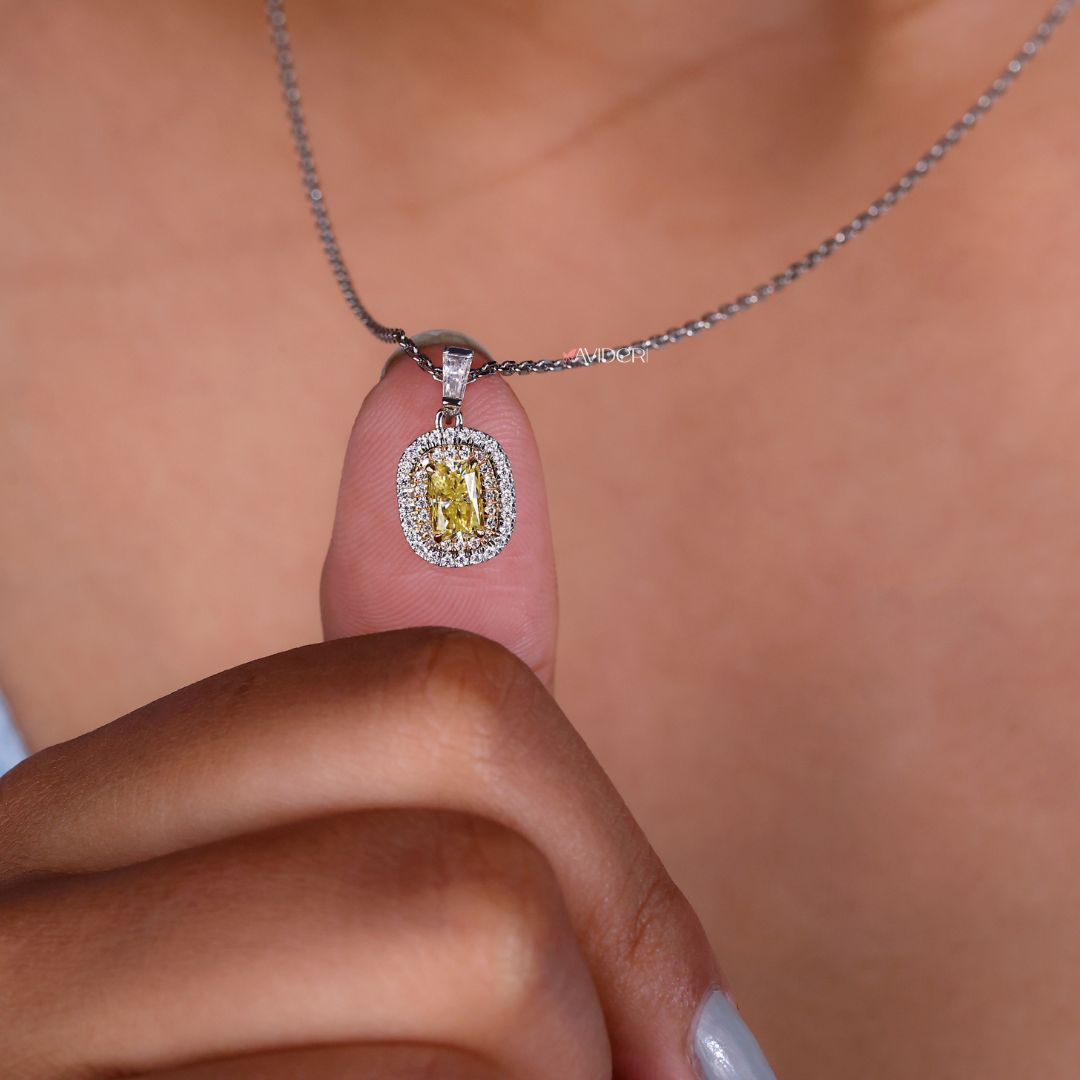 Double halo pendant with moissanite center and baguette sides.