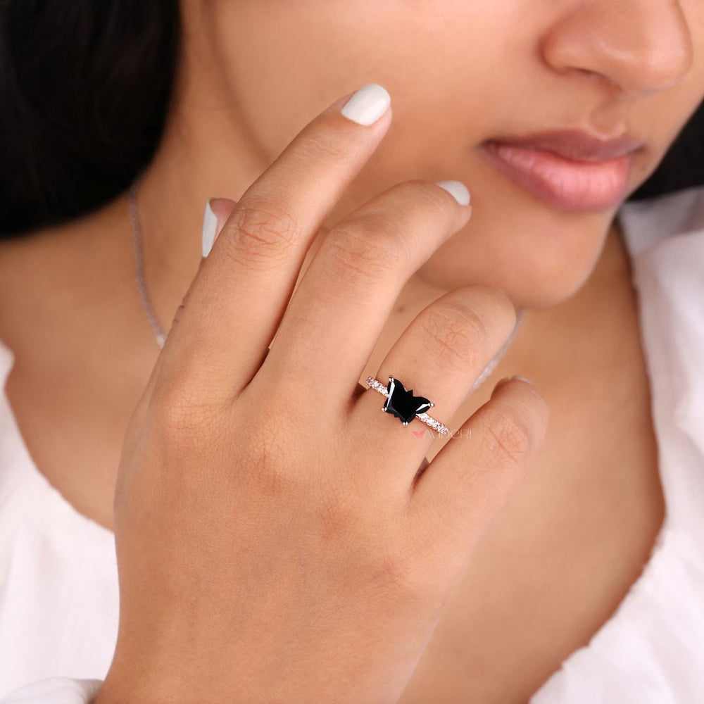 Moissanite promise ring with a black butterfly design for a meaningful gift.

