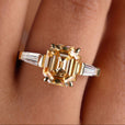 Emerald Krupp ring set with tapered baguette side stones
