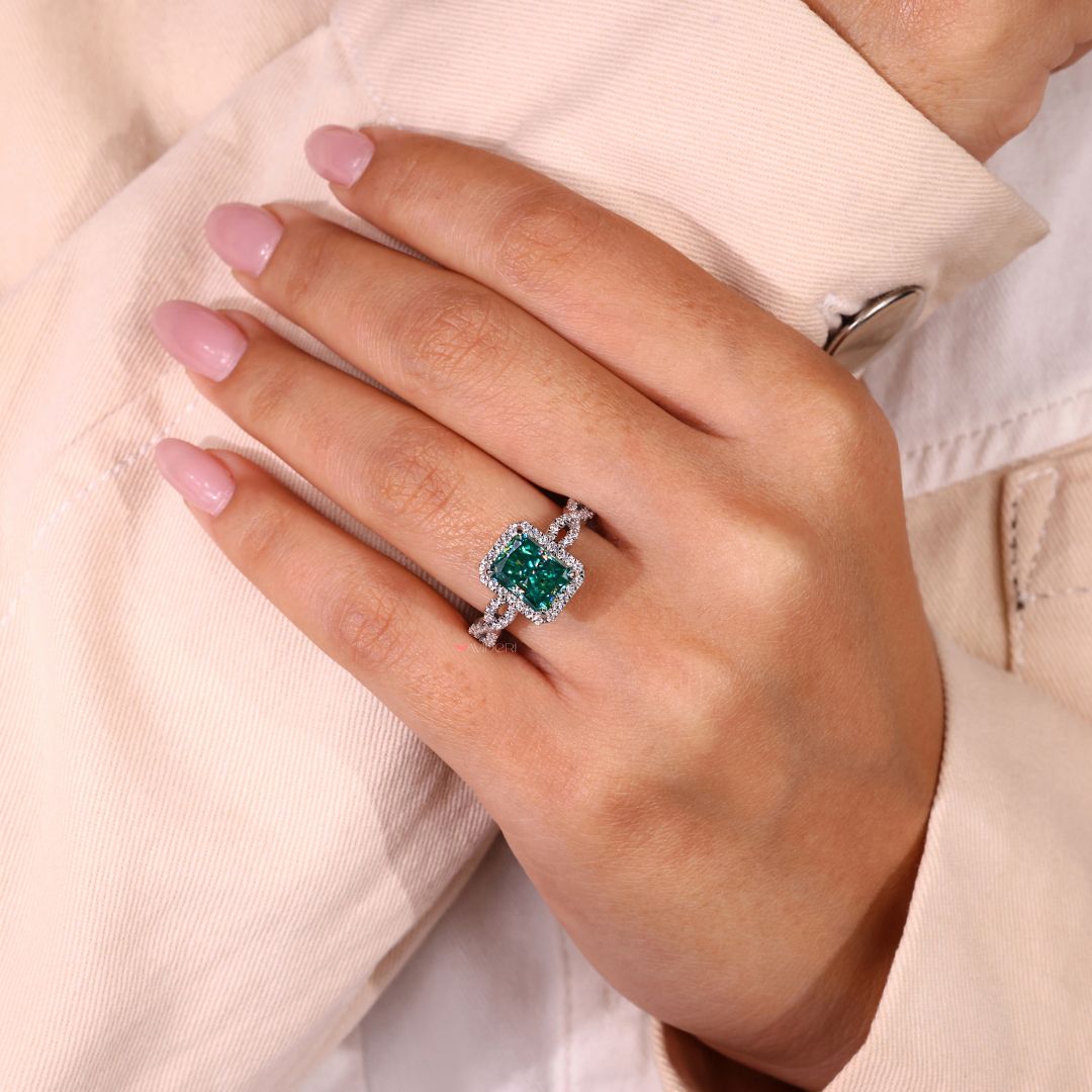 Handmade ring with a radiant cut stone and claw prong setting.

