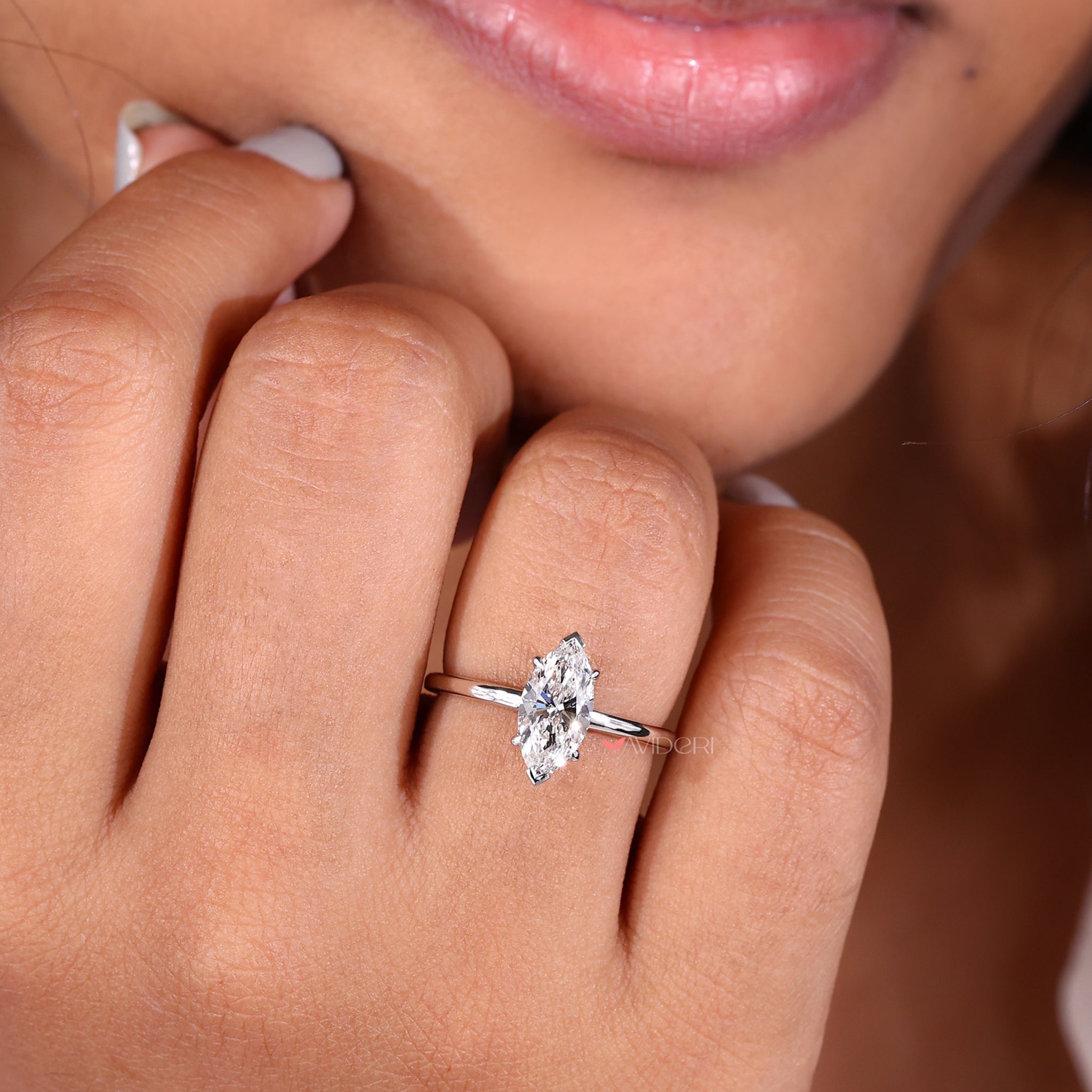 Marquise solitaire diamond ring crafted with igi certified materials and a sophisticated v prong diamond setting.
