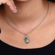 White gold pendant with a refined design.