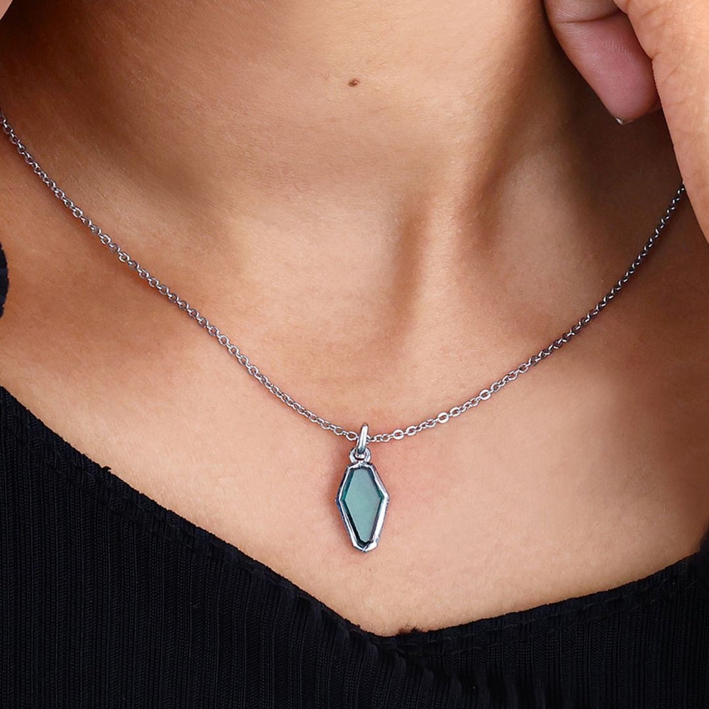 Portrait pendant features detailed craftsmanship with elegant charm.