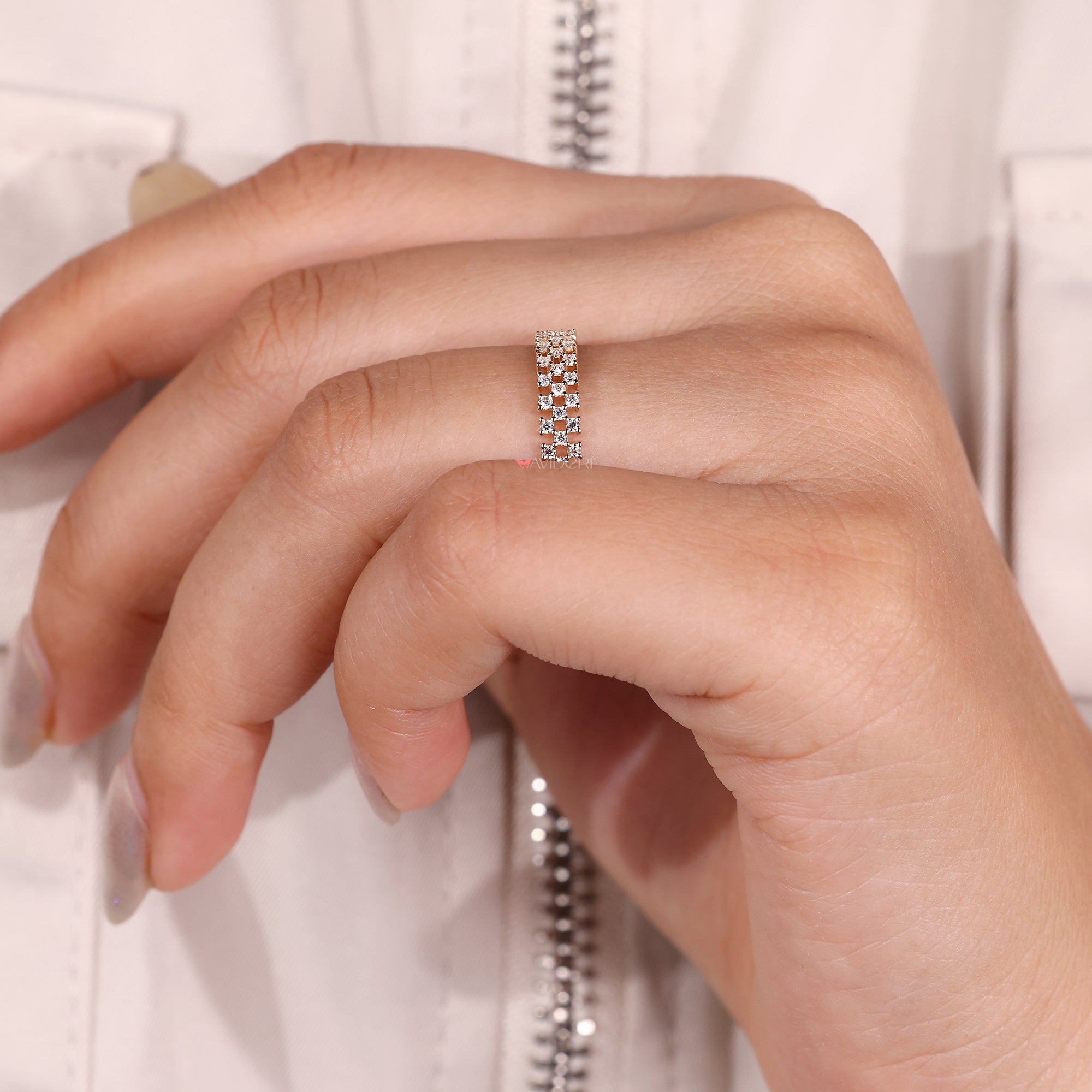 Round cut moissanite band with shared prong setting.