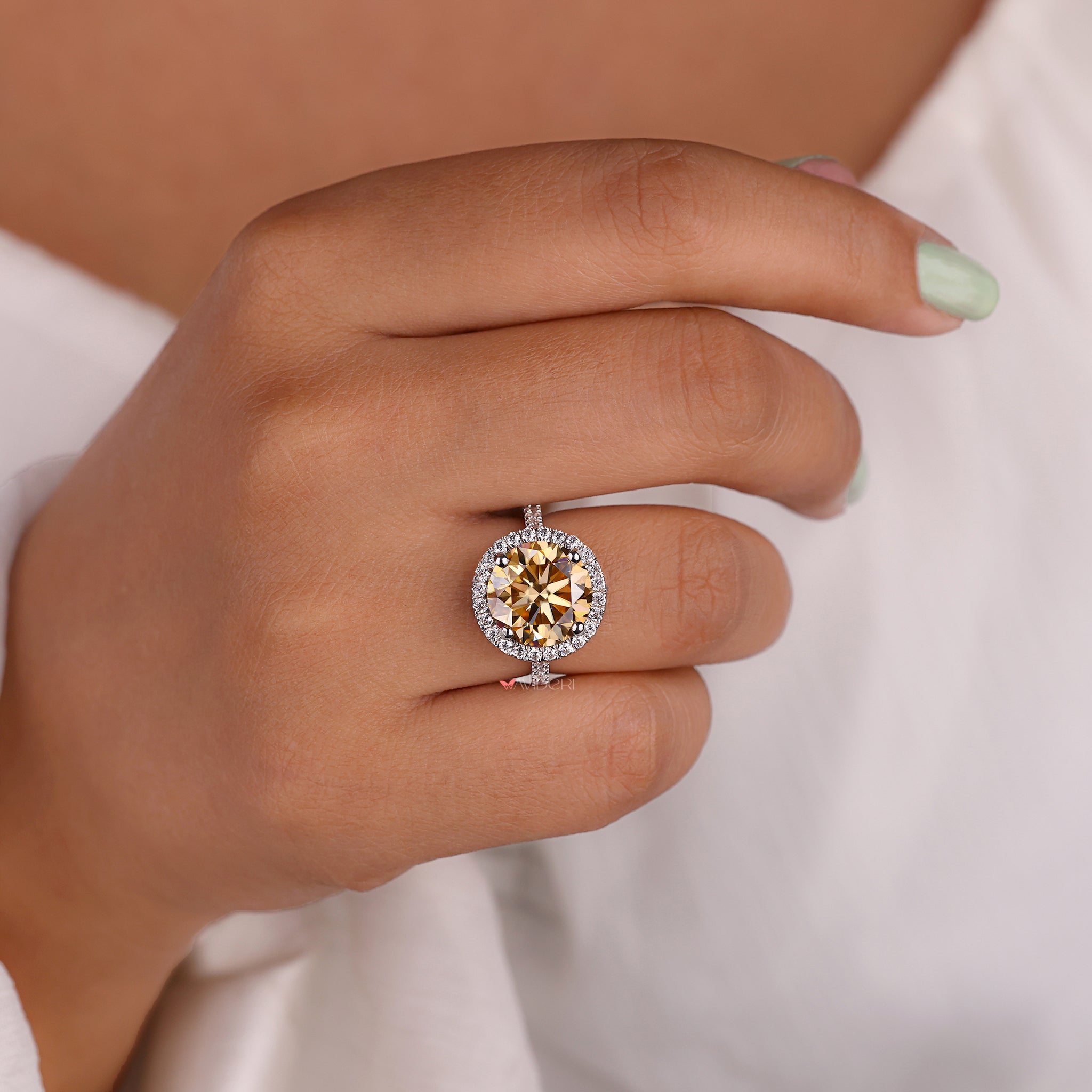 Buy moissanite ring featuring a round cut center stone.
