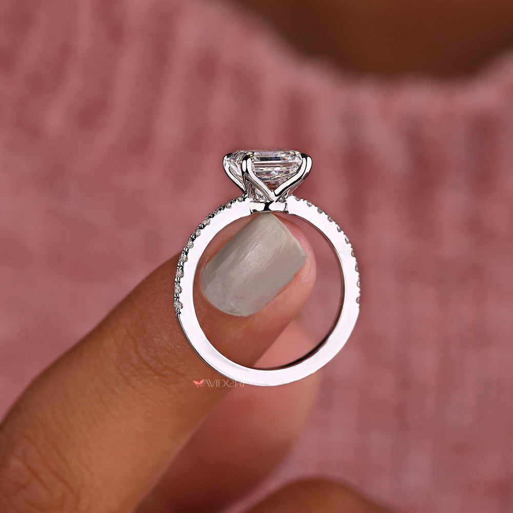 Asscher cut ring with round diamond pave band design.
