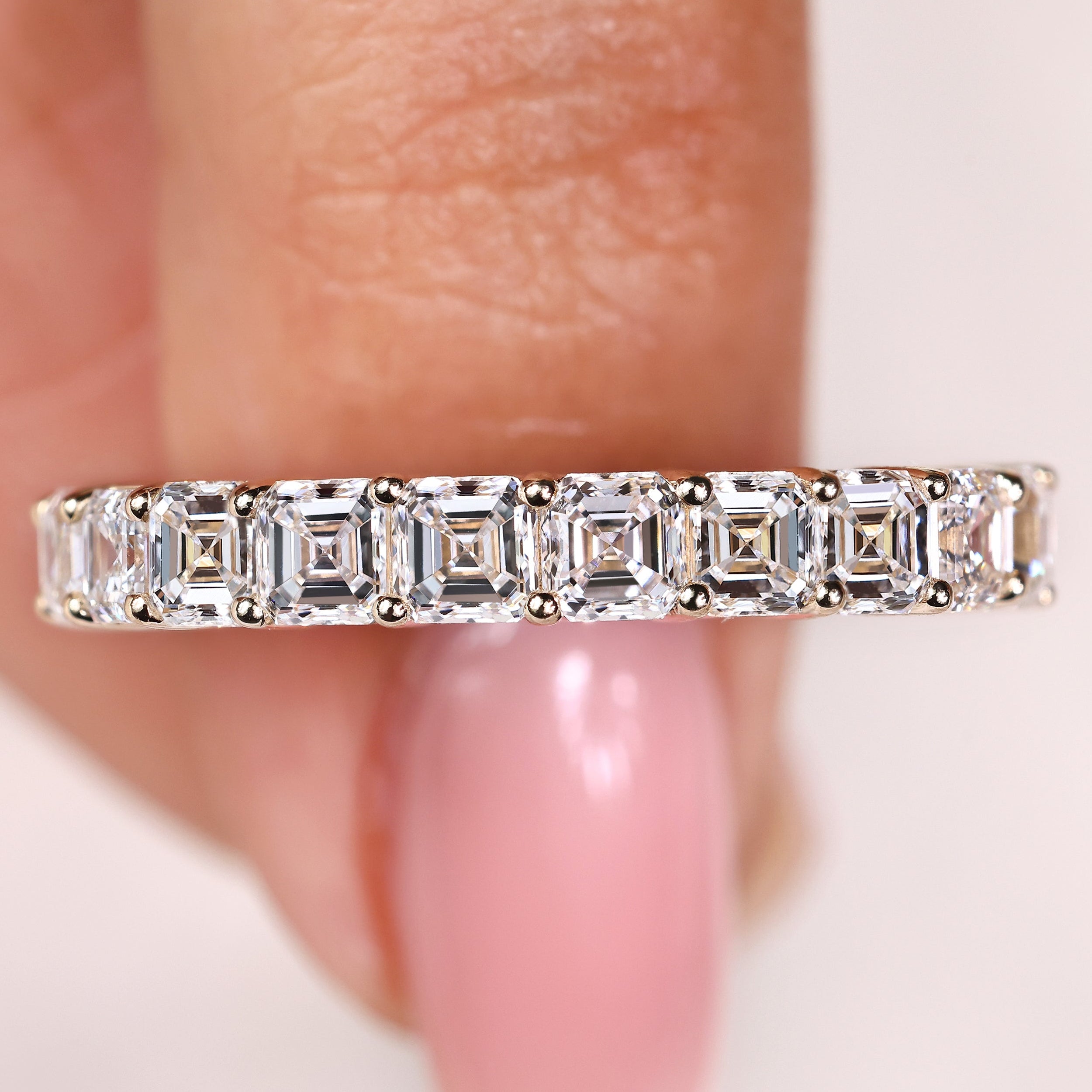 Asscher diamond semi eternity band with classic prong setting
