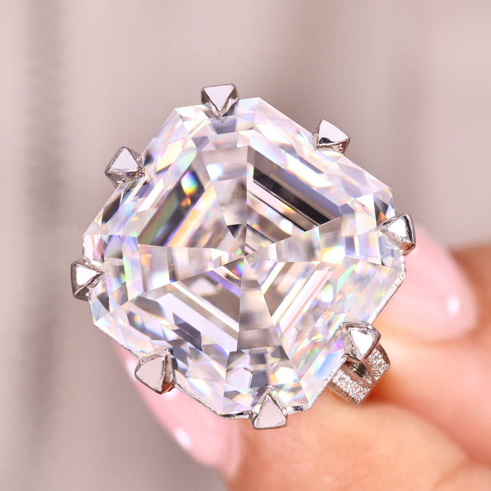 Asscher cut moissanite ring with cathedral setting.