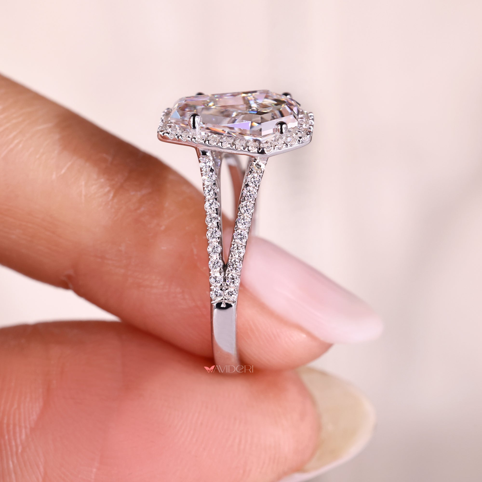 Coffin cut diamond ring with bridge detail.