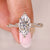 Marquise cut diamond ring with hidden halo design.
