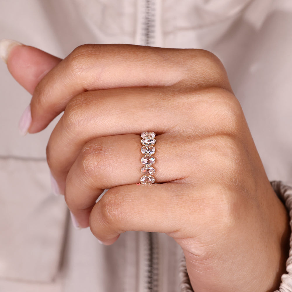 Handmade eternity band with shared prong setting.

