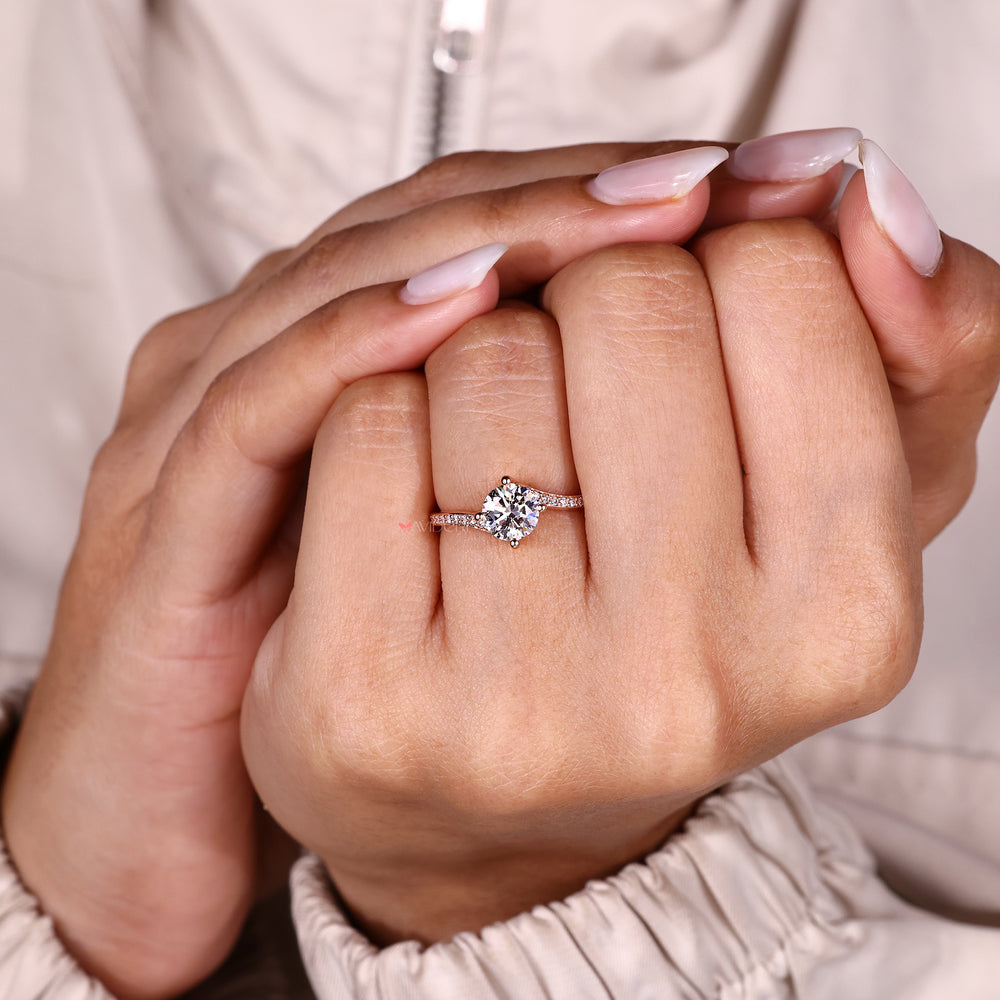 Round diamond ring in elegant bypass setting.
