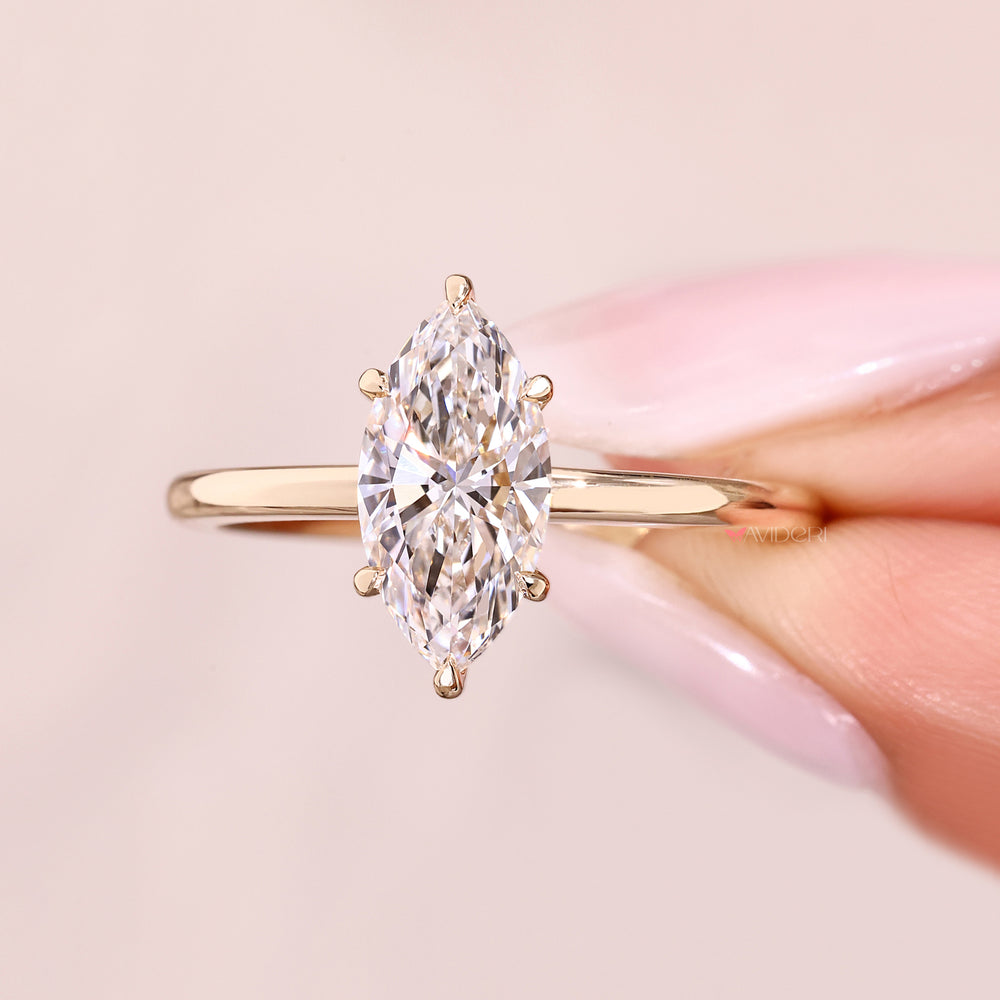 Marquise cut solitaire ring with IGI certified lab diamond.
