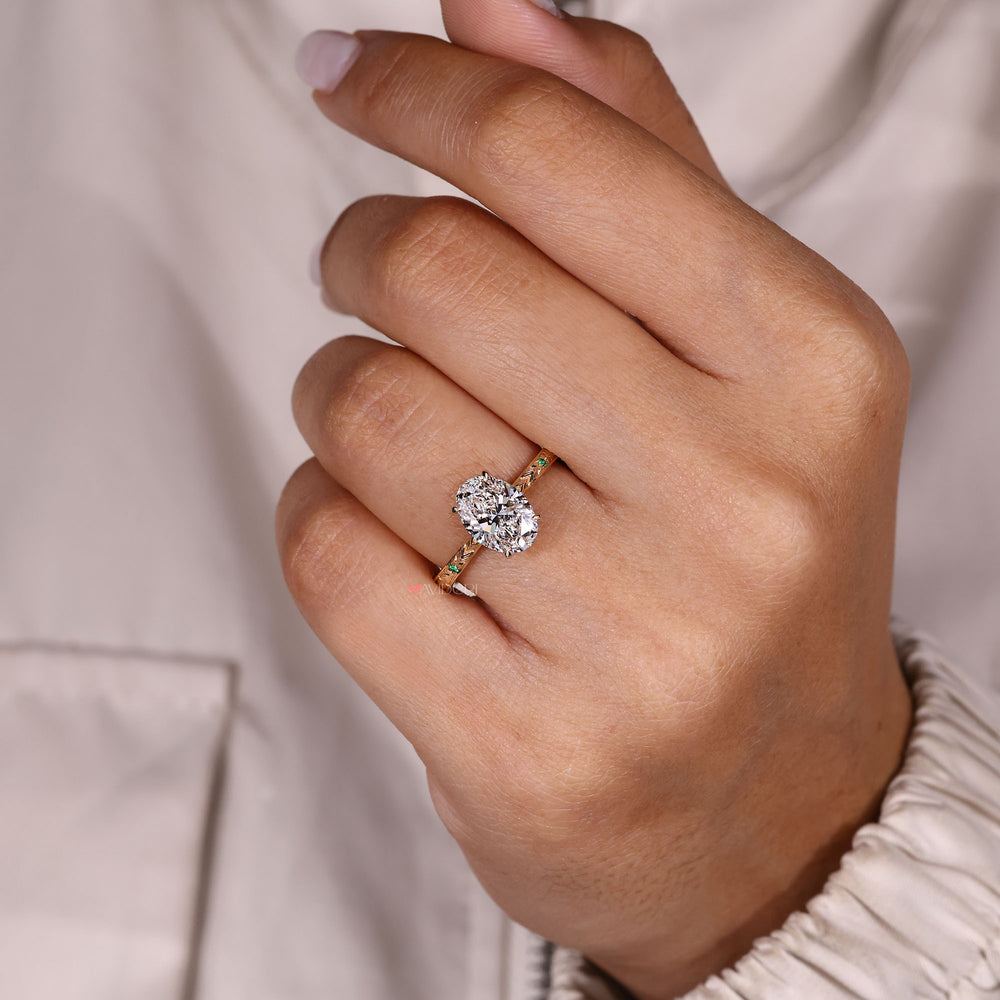 Elegant oval diamond ring with hand engraved band.
