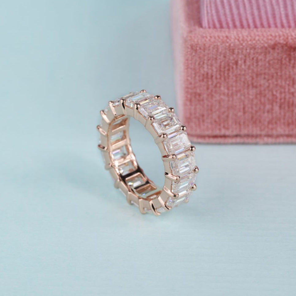 Emerald cut wedding band showcases sleek lines and a bold, modern profile.
