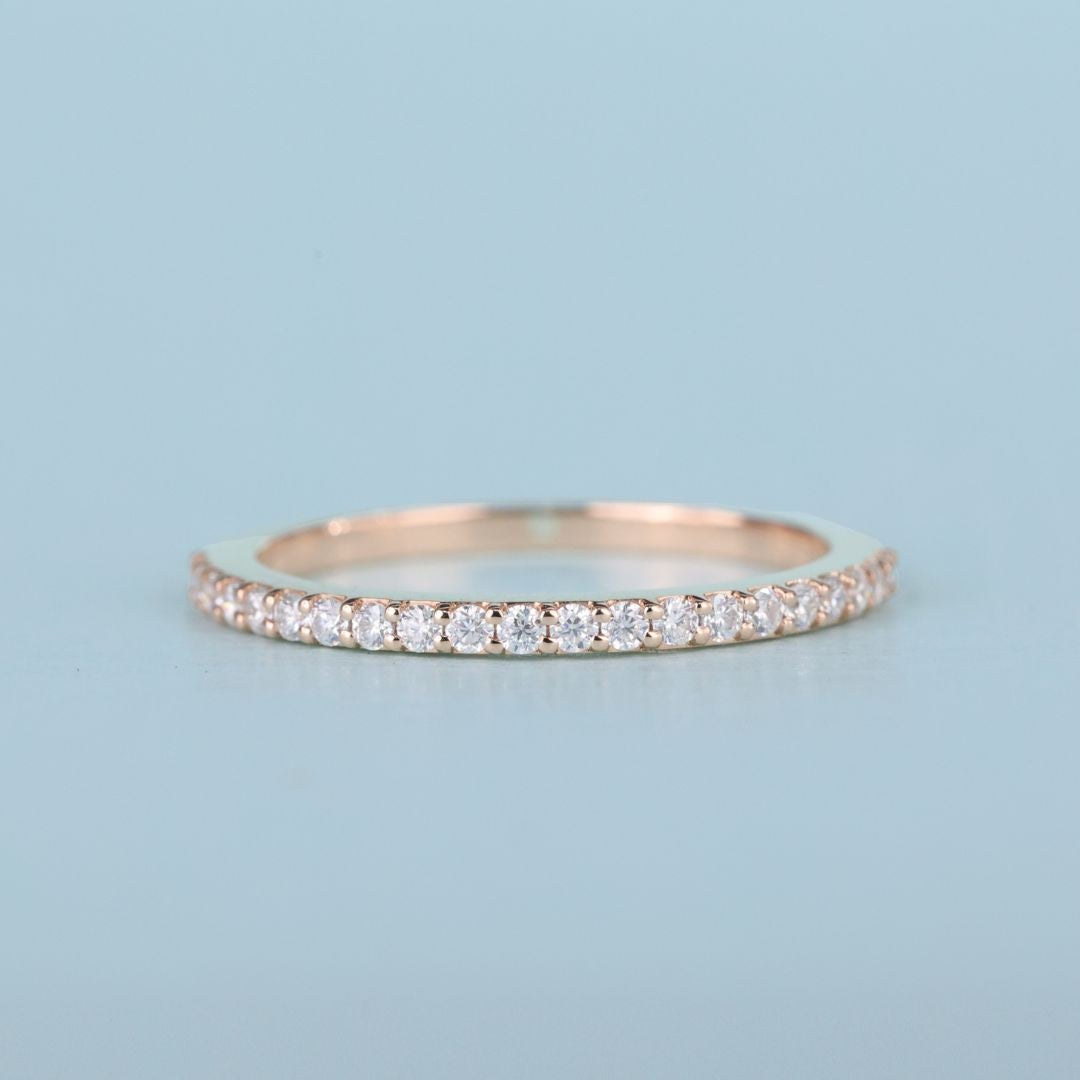 Matching wedding band pairs seamlessly with engagement rings for a cohesive bridal look.
